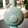 清 天青釉暗刻八寶紋雙耳扁瓶